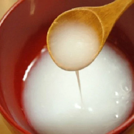 The unique benefits of rice water for hair + how to use it